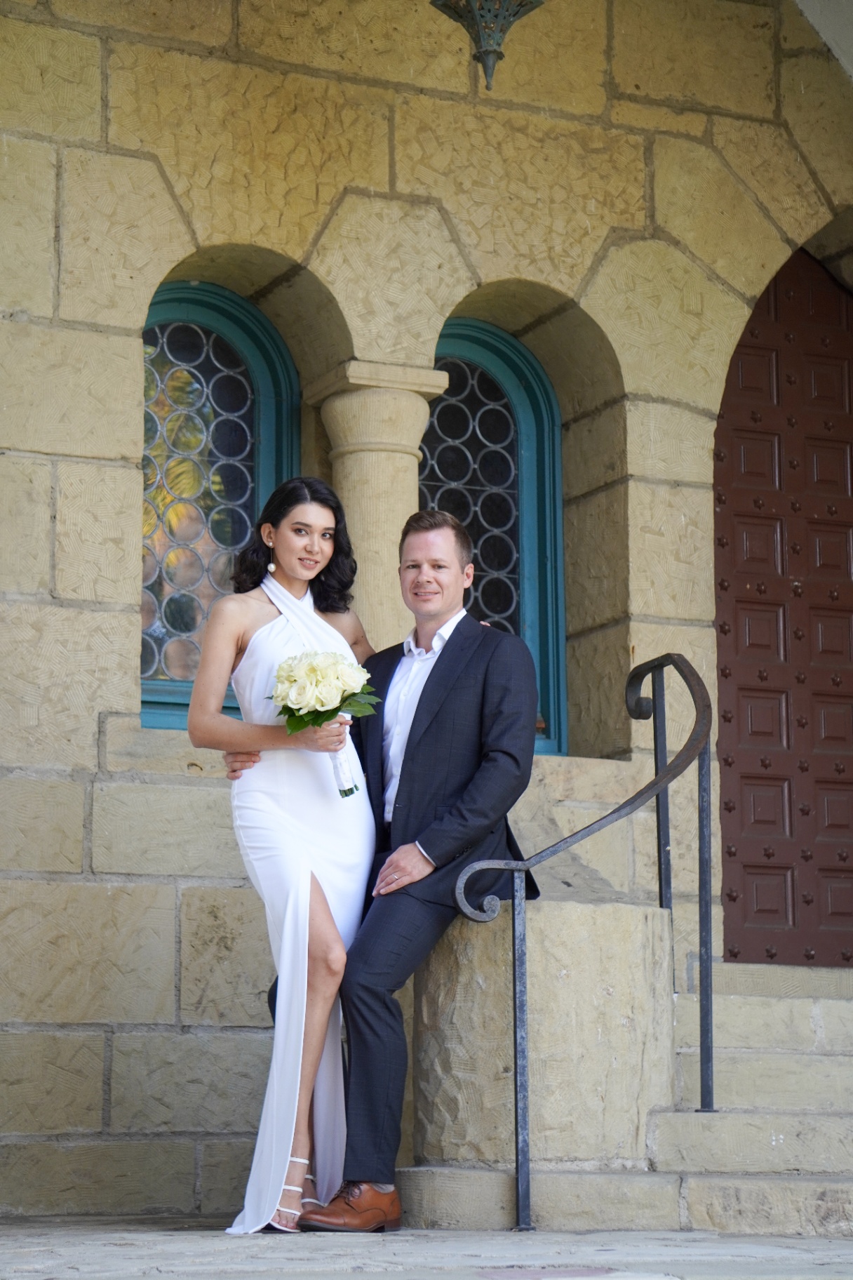 Bride and groom at stone arches