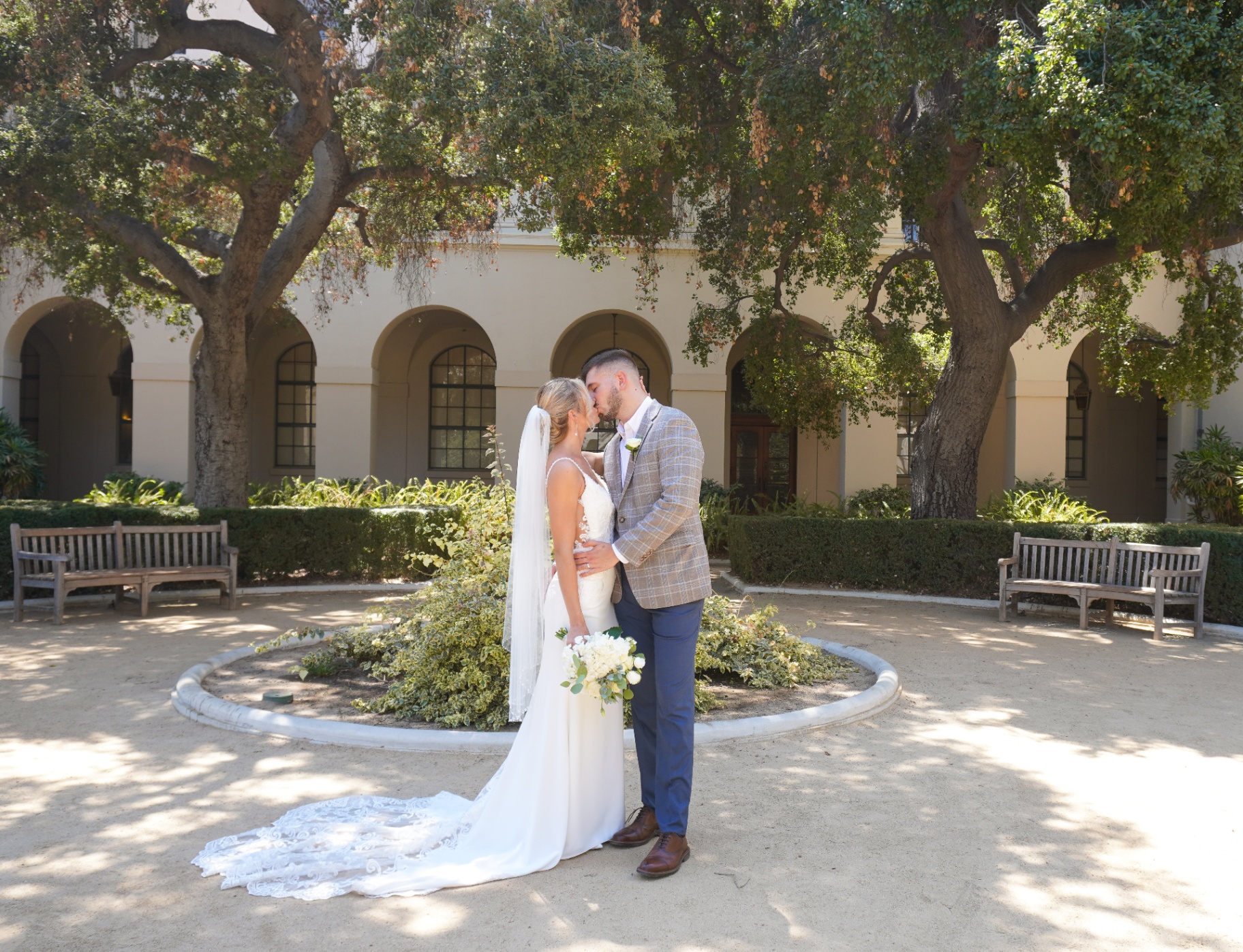 Courtyard wedding kiss